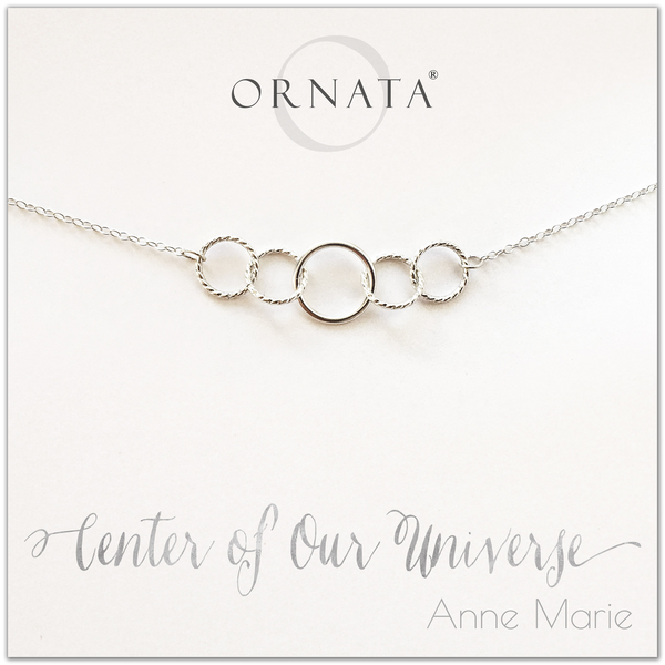 Center of our Universe necklace - personalized silver necklaces. Our sterling silver custom jewelry is a perfect gift for best friends, sisters, daughters, or mothers. Inspirational jewelry is also a good gift for Mother’s Day. Interlocking silver rings represent family and friendship.