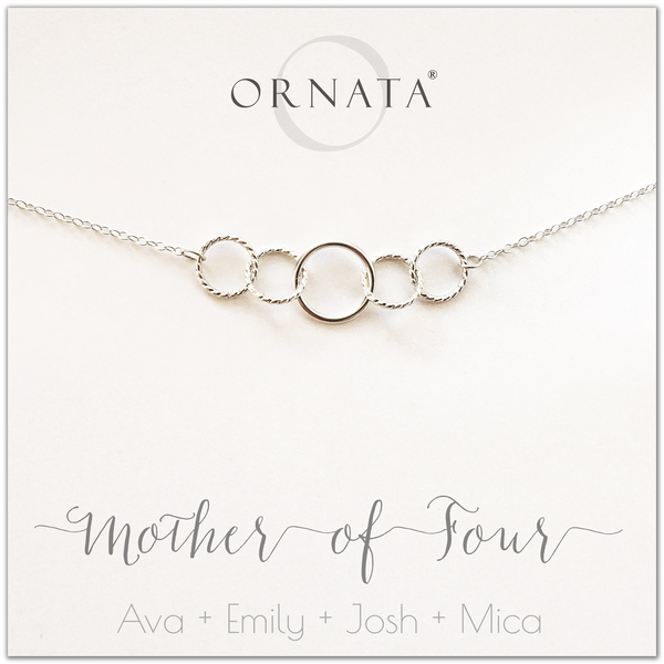 Mom or Mother of Four - personalized silver necklaces. Our sterling silver custom jewelry is a perfect gift for mothers of four children, wives, or family members. Also a good gift for Mother’s Day. Delicate sterling silver interlocking rings represent a mother and her four children.