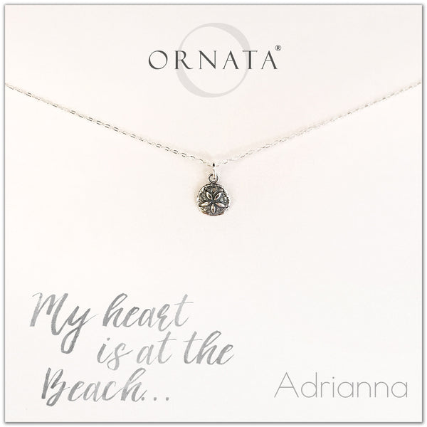 My heart is at the beach. Personalized silver sand dollar necklace. Our sterling silver custom jewelry is a perfect gift for people who love the ocean, the sea, seashells, or the beach.