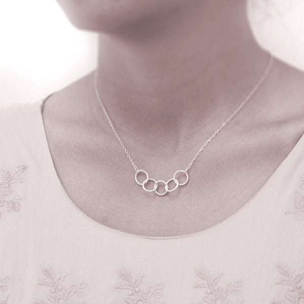 Custom 5 best friends necklace - personalized jewelry is sterling silver and the custom friendship necklaces are good gifts for best friends or sisters. Represents five best friends with 5 sterling silver interlocking rings.