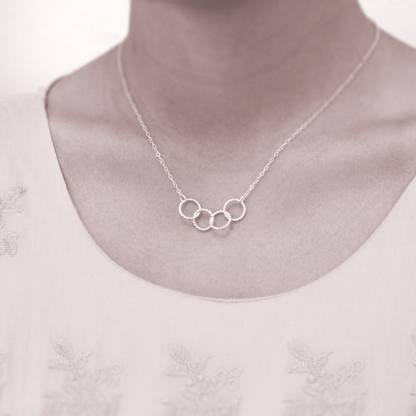 Custom 4 best friends necklace - personalized jewelry is sterling silver and the custom friendship necklaces are good gifts for best friends or sisters. Represents four best friends with 4 sterling silver interlocking rings.