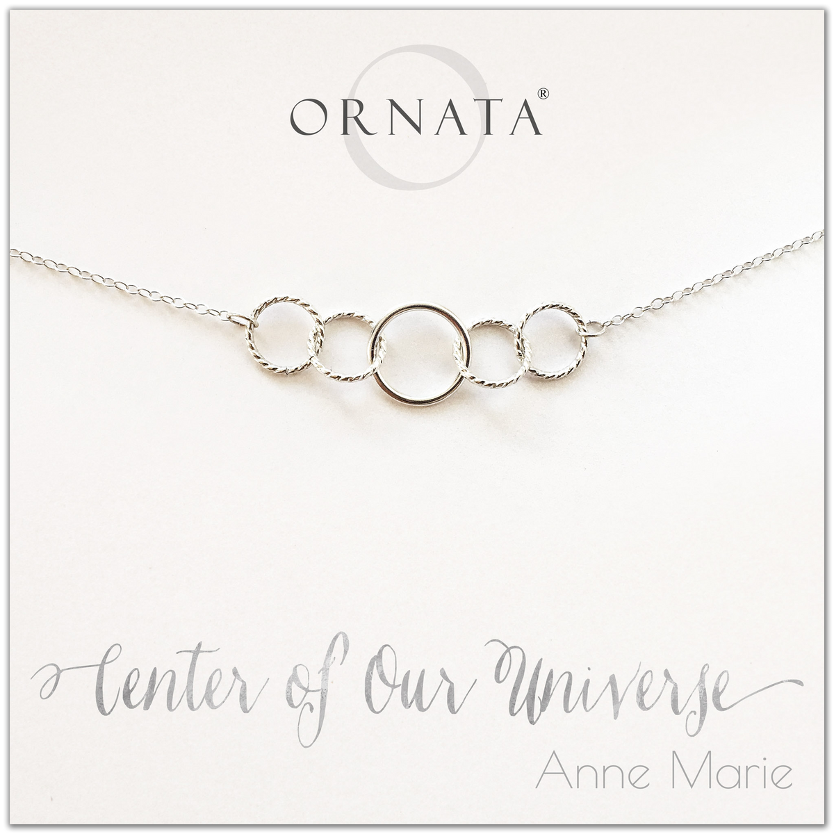 Center of our Universe necklace - personalized silver necklaces. Our sterling silver custom jewelry is a perfect gift for best friends, sisters, daughters, or mothers. Inspirational jewelry is also a good gift for Mother’s Day. Interlocking silver rings represent family and friendship.