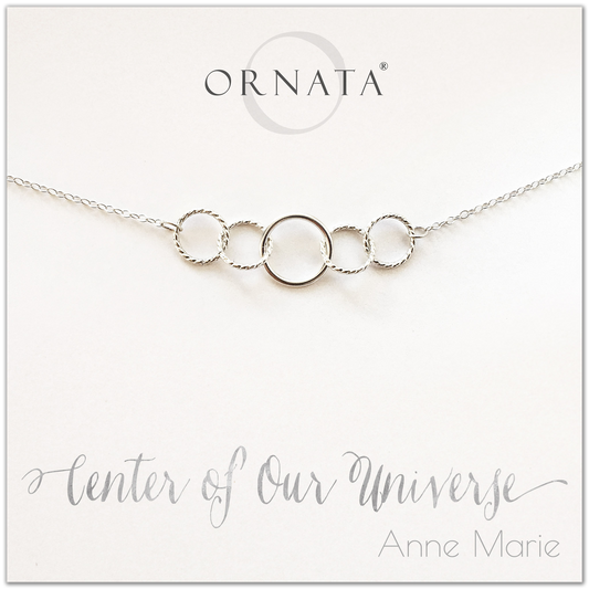 Center of our Universe necklace - personalized silver necklaces. Our sterling silver custom jewelry is a perfect gift for best friends, sisters, daughters, or mothers. Inspirational jewelry is also a good gift for Mother’s Day. Interlocking silver rings represent family and friendship.