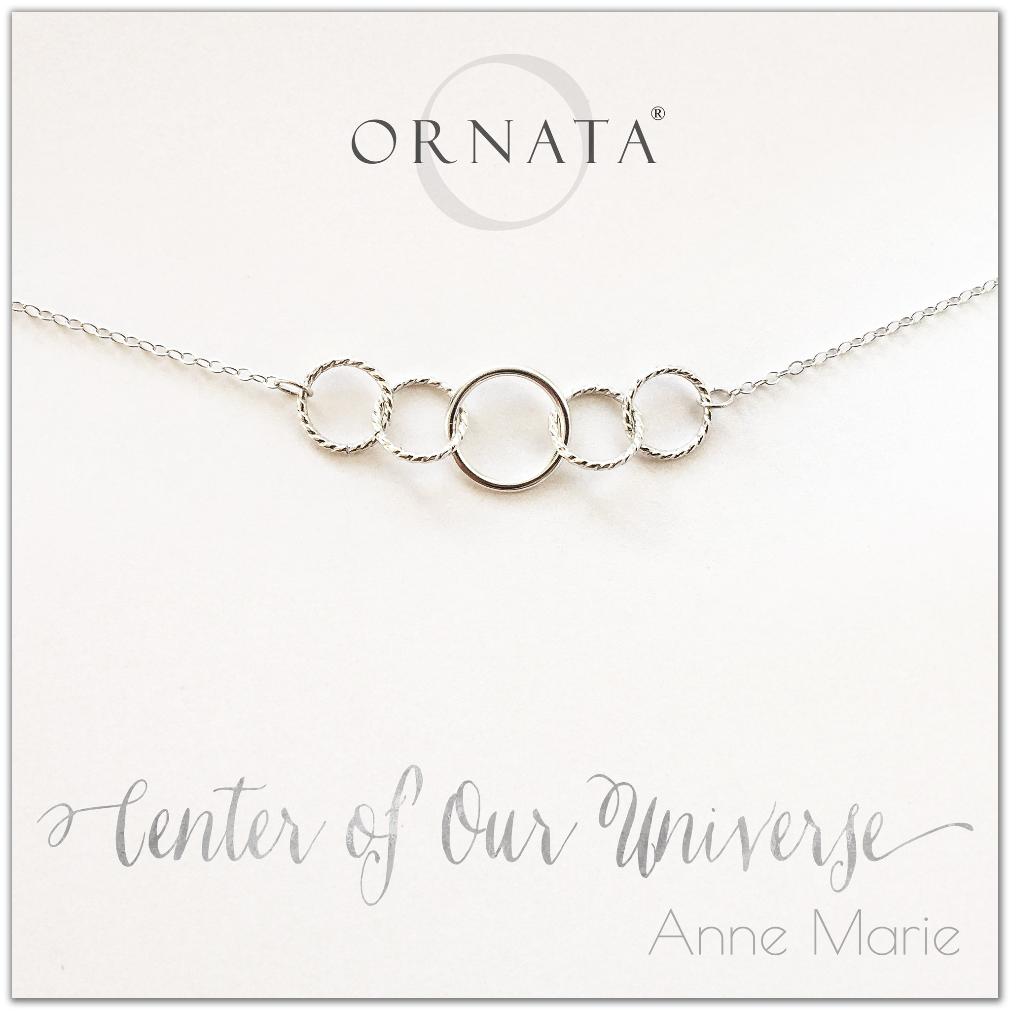 Center of our Universe necklace - personalized silver necklaces. Our sterling silver custom jewelry is a perfect gift for best friends, sisters, daughters, or mothers. Inspirational jewelry is also a good gift for Mother’s Day. Interlocking silver rings represent family and friendship.