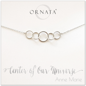 Center of our Universe necklace - personalized silver necklaces. Our sterling silver custom jewelry is a perfect gift for best friends, sisters, daughters, or mothers. Inspirational jewelry is also a good gift for Mother’s Day. Interlocking silver rings represent family and friendship.