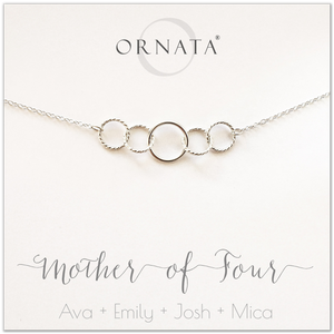 Mom or Mother of Four - personalized silver necklaces. Our sterling silver custom jewelry is a perfect gift for mothers of four children, wives, or family members. Also a good gift for Mother’s Day. Delicate sterling silver interlocking rings represent a mother and her four children. 