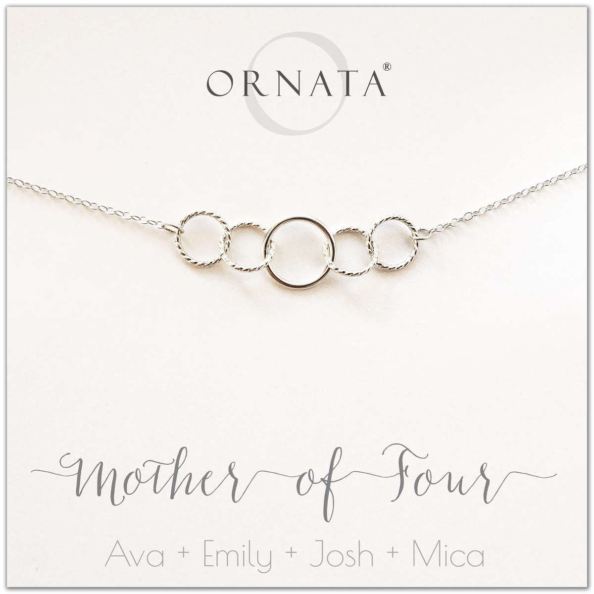 Mom or Mother of Four - personalized silver necklaces. Our sterling silver custom jewelry is a perfect gift for mothers of four children, wives, or family members. Also a good gift for Mother’s Day. Delicate sterling silver interlocking rings represent a mother and her four children. 