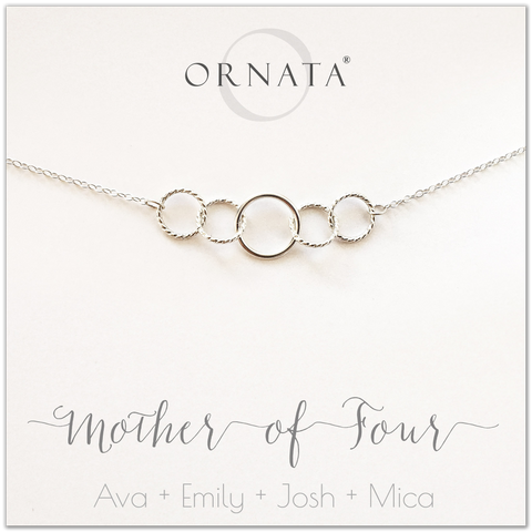 Mom or Mother of Four - personalized silver necklaces. Our sterling silver custom jewelry is a perfect gift for mothers of four children, wives, or family members. Also a good gift for Mother’s Day. Delicate sterling silver interlocking rings represent a mother and her four children. 