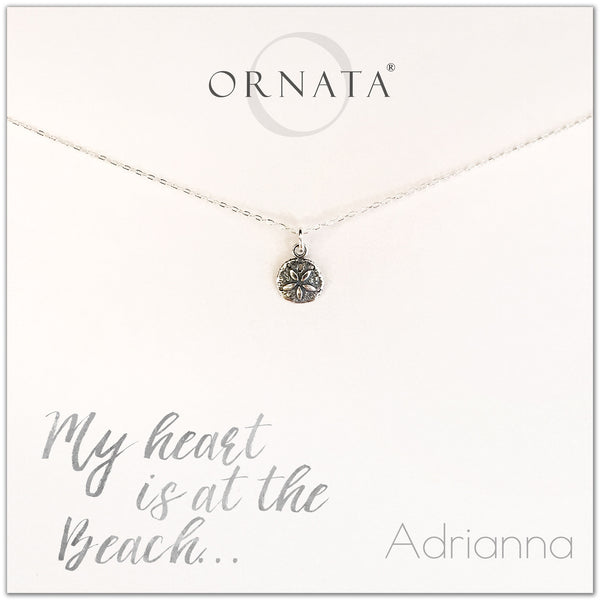 My heart is at the beach. Personalized silver sand dollar necklace. Our sterling silver custom jewelry is a perfect gift for people who love the ocean, the sea, seashells, or the beach. 