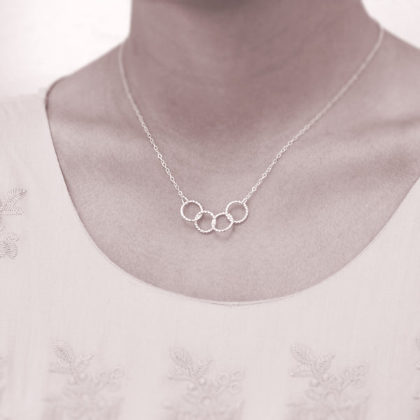 Custom 4 best friends necklace - personalized jewelry is sterling silver and the custom friendship necklaces are good gifts for best friends or sisters. Represents four best friends with 4 sterling silver interlocking rings.  